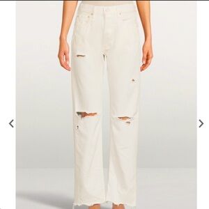 White boot cut with knee slit jeans